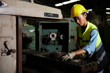 factory worker using tape measure and measuring spare parts in the factory