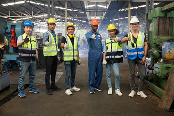 group of workers or engineers thumbs up pose for success work and project in the factory