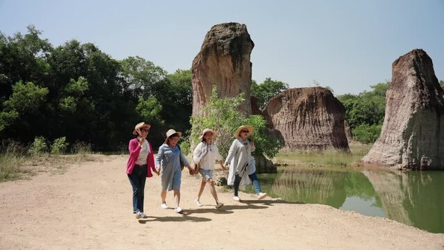 Elderly women are in good health, come admire their favorite nature, hold hands walk in front each other, walking around happily, everyone expressions smile with happiness from their hearts.