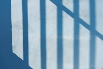 Blue wall with shadows on it