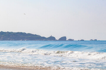 Extremely huge big surfer waves beach La Punta Zicatela Mexico.