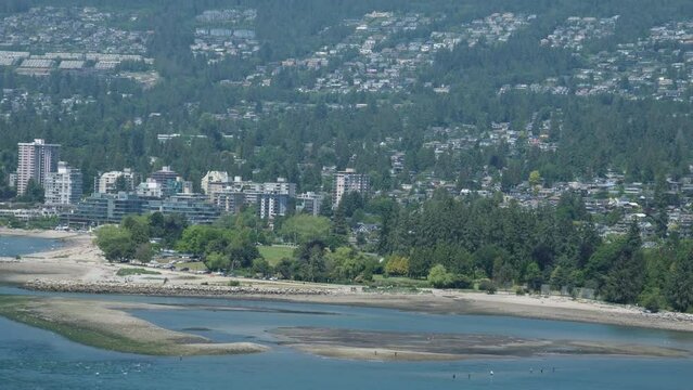 Lions Gate Bridge Traffic, Mountains, Park Summer Day Stanley Park shooting namaz that iron structure the sun is shining Clear sky ships airplanes Pacific Ocean view of Stanley Park