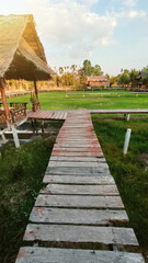 Houses nestled in a riverside village, surrounded by trees and gardens