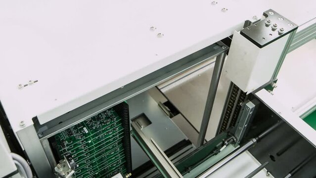 Electronic printed circuit Board green PCB on the conveyor. Time lapse. 4K.