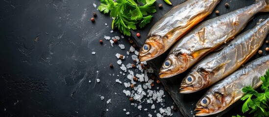Salted fish on black background with room for text.