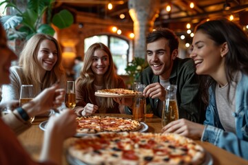 A group of young people having a good time having pizza and drinks in a restaurant