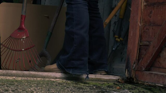 Gardener gets rake from garage