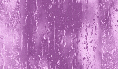 pink background. of natural water condensation on window glass 