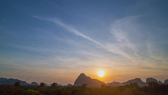 Time lapse High peaks wonderful morning sunrise natural Landscape .above Samed Nang Chee Phang Nga viewpoint. .amazing bright yellow sky at sunrise. .tropical landscape background.
