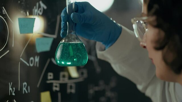 In the laboratory, a scientist carefully examines a flask containing cutting-edge developments that could help combat widespread famine in African countries