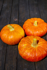 Close up, top view of pumpkin on wooden surface. Copy space