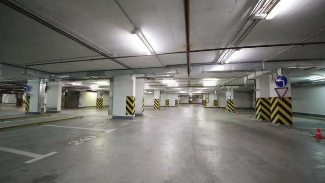 Spacious modern empty underground car park with free parking spaces 