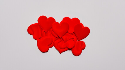 red hearts tissue on light background