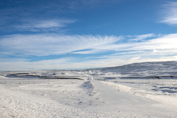 Fototapeta na wymiar Country with a fresh snow and blue sky, Iceland