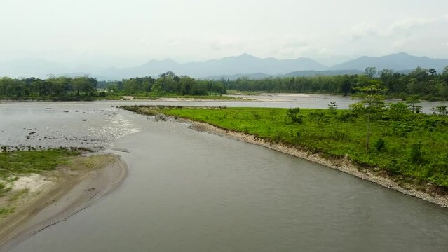 Range forest officer ride elephant in the kameng river  in nameri national park in assam in the eastern himalayan mountains. assam, india