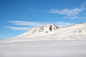 Fototapeta na wymiar Country with a fresh snow and blue sky, Iceland