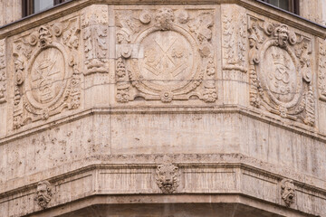 Munich, Germany -April 27,2023: Details of stone ornaments on the facades of baroque buildings in the German city Munich.