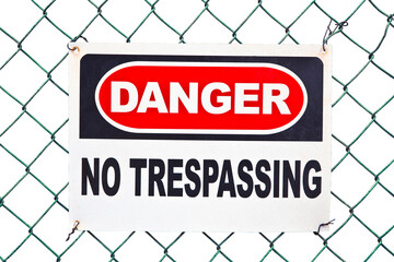 Information with warning sign and no trespassing signboard against a wire mesh - concept isolated...