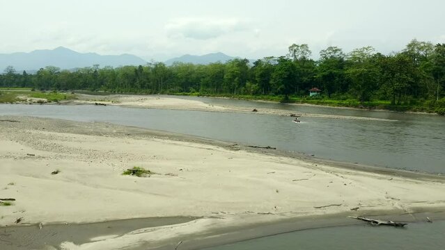 Range forest officer ride elephant in the kameng river  in nameri national park in assam in the eastern himalayan mountains. assam, india