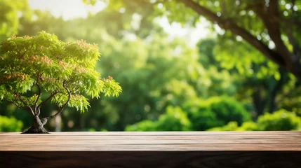 Fotobehang Wooden table with garden blurred bokeh background © Philippova