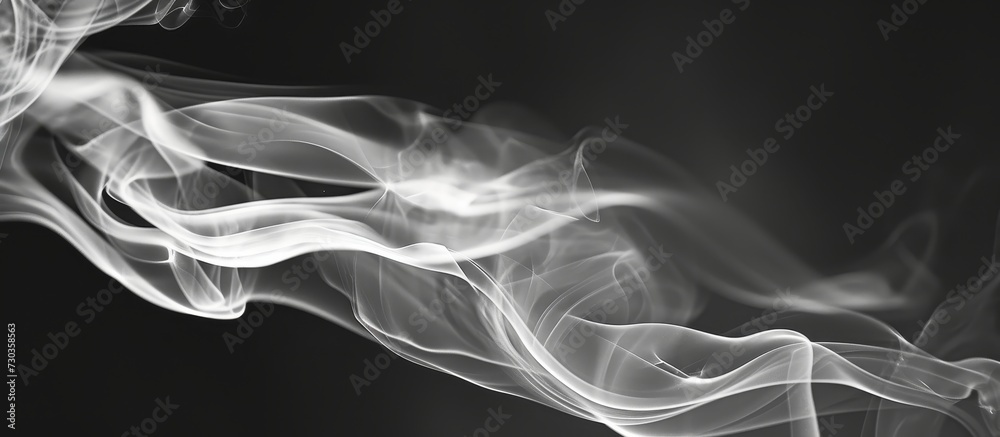 Poster Black and white closeup of incense stick smoke in an abstract image.