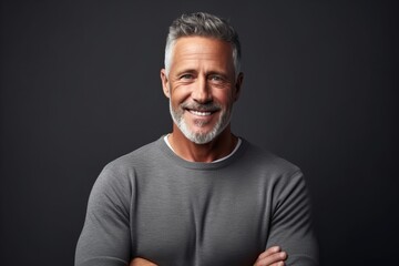 Portrait of a handsome mature man in grey t-shirt.