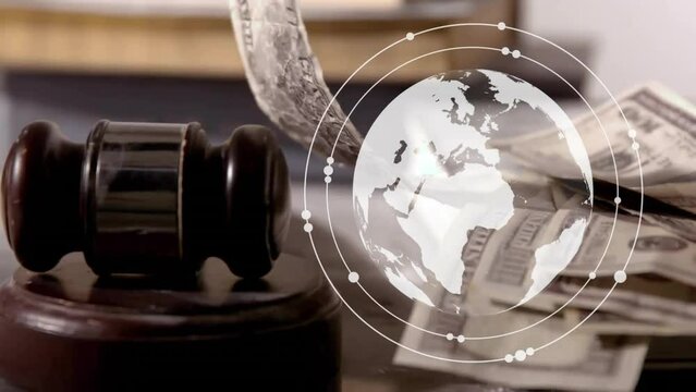 Animation of spinning globe over banknotes and gavel