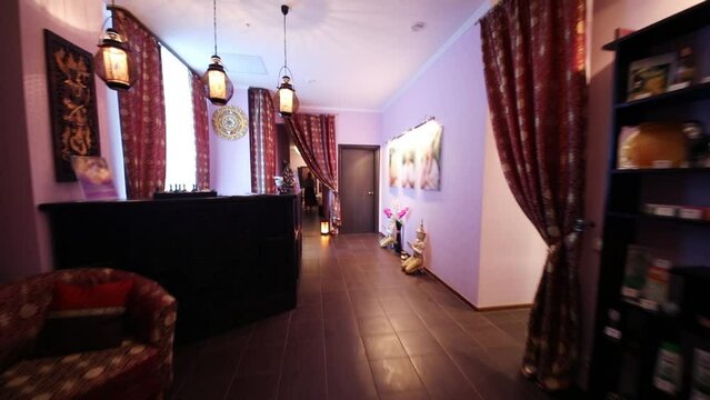 Wooden reception with carving in thai day spa with asian decoration