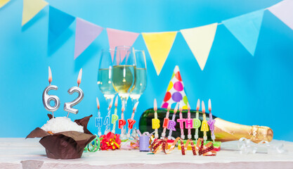 Date of birth with candles and number  62. Anniversary greeting card. Holiday decorations. Happy...