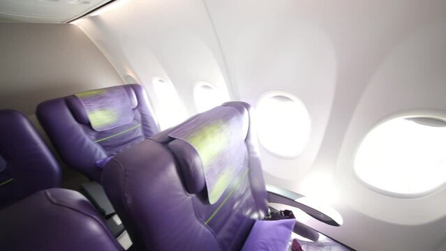 Empty modern interior with seats in business class aircraft 