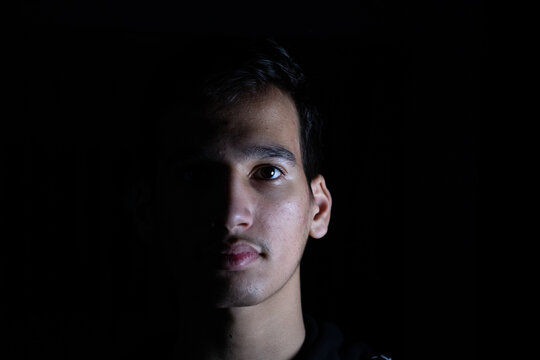 Portrait for teenager in dark and light studio