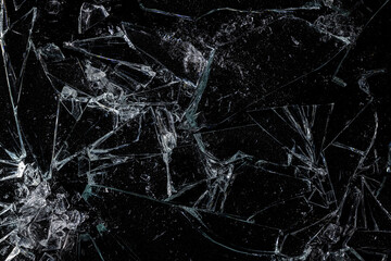 Pieces of Broken Glass Shattered on a Black Background