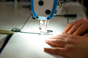 Sewing machine. Close up. Working in the tailor shop. 