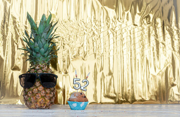 Cheerful pineapple in glasses festive happy birthday character with number  52. Beautiful...