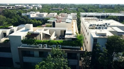 Explore luxurious apartments with rooftop pools in a stunning drone video. From above, witness the beauty of real estate and serene swimming pool views.