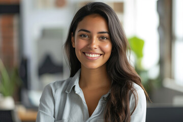 Confident Latin professional in office environment smiling at camera