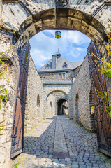 Naklejka premium Arched gates and old stone street 