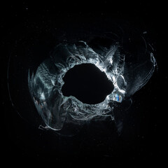 Broken Glass Hole on Black Background