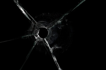 Cracked Pieces Broken Glass Hole on Black Background - obrazy, fototapety, plakaty