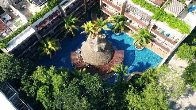 Explore luxurious apartments with rooftop pools in a stunning drone video. From above, witness the beauty of real estate and serene swimming pool views.