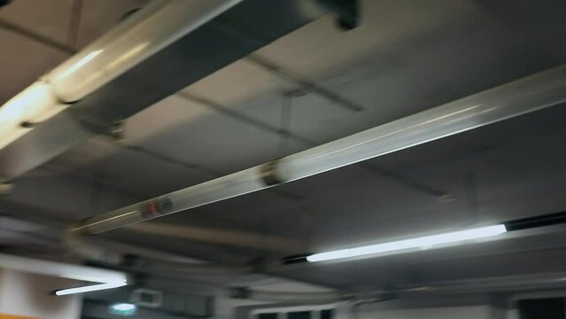 Capsule moves in plastic tube of pneumatic rabbit on ceiling