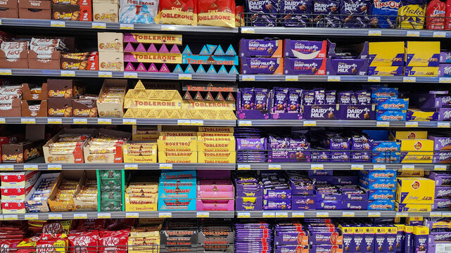 various chocolate brands in the shelf of supermarket.