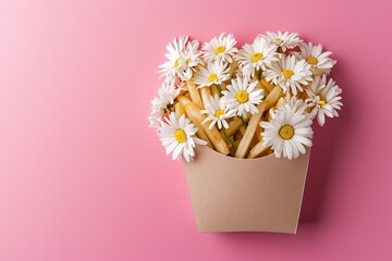 A Pink Cup Filled With French Fries And Daisies On A Pink Background