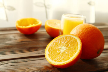 Fresh ripe juicy oranges on light background