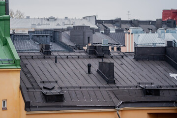 A modern black tin roof for an apartment building
