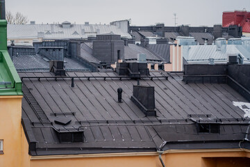 A modern black tin roof for an apartment building
