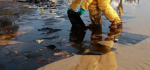 A crude oil spill on the sand of a city beach Beach oil spill impacts pollution waste disposal...