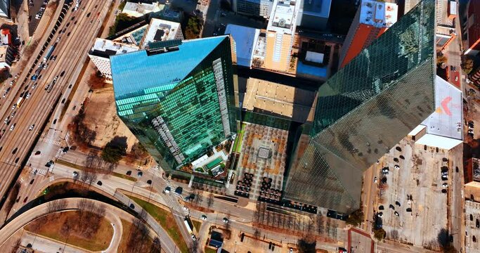 Beautiful buildings of Fountain Place and AMLI Fountain Place mirroring the surrounding. Top view on the Dallas downtown on sunny day.