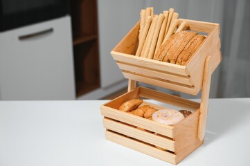 Craft wooden plate for storing bread or vegetables in the kitchen