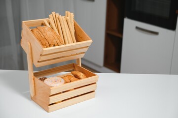 Craft wooden plate for storing bread or vegetables in the kitchen